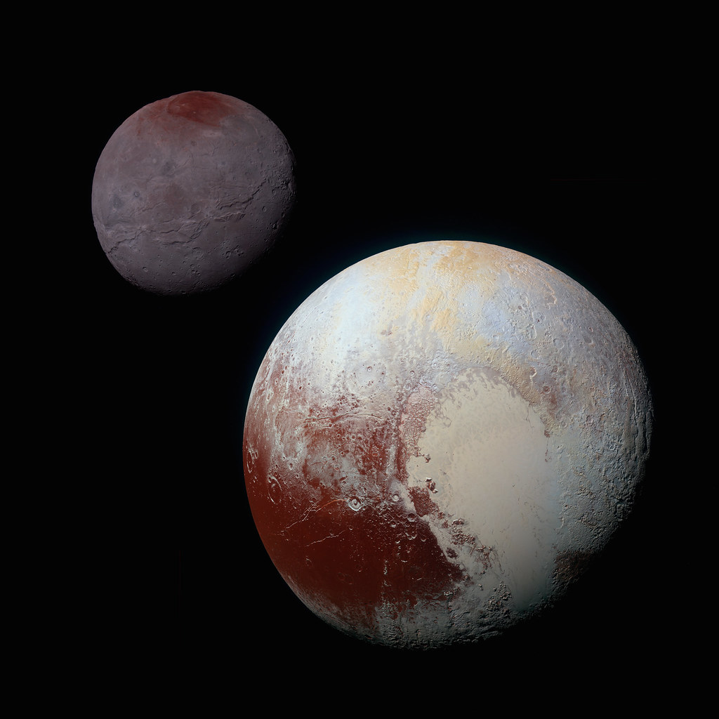 A close-up image of the planet Pluto and it's moon, Charon.