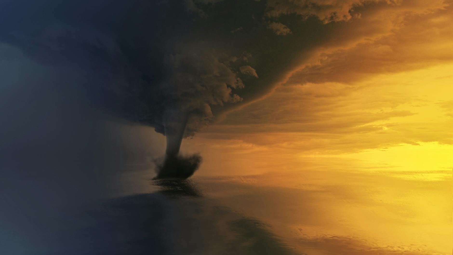 tornado on body of water during golden hour